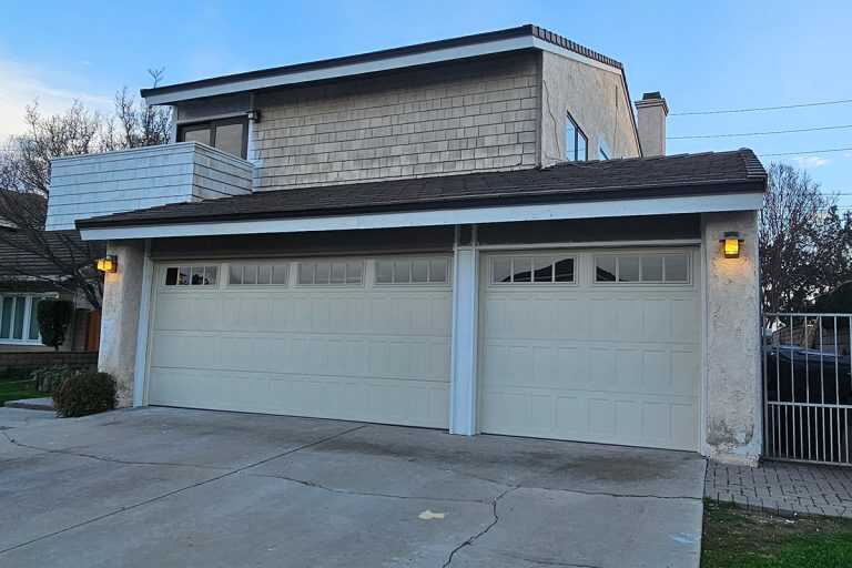 Garage Door installation for Home Remodel in Brea, CA Almond stamped shaker garage doors with Madison windows installed during a home remodel in Brea, CA.